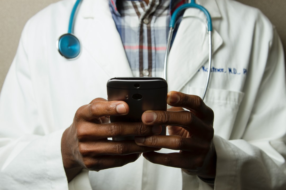 Telehealth: Doctor Holding Smartphone